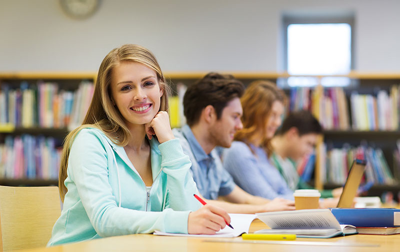 Student Smiling at School Library 